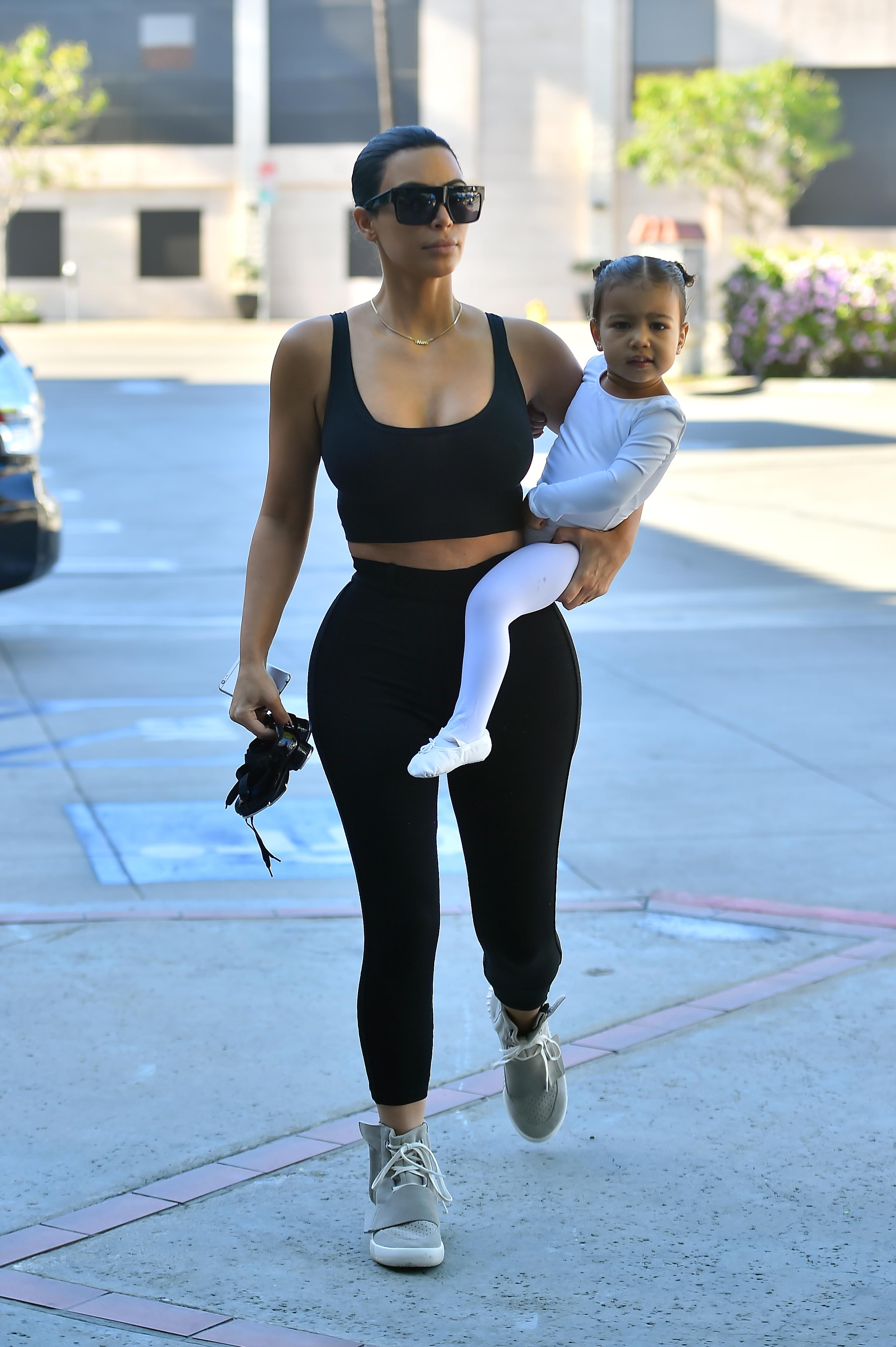 Kim Kardashian is back to black hair as she takes her little ballerina to a dance class