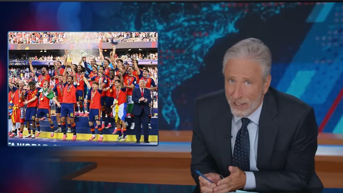 Image of Jon Stewart roasted Donald Trump for lingering during the FIFA World Cup trophy ceremony.