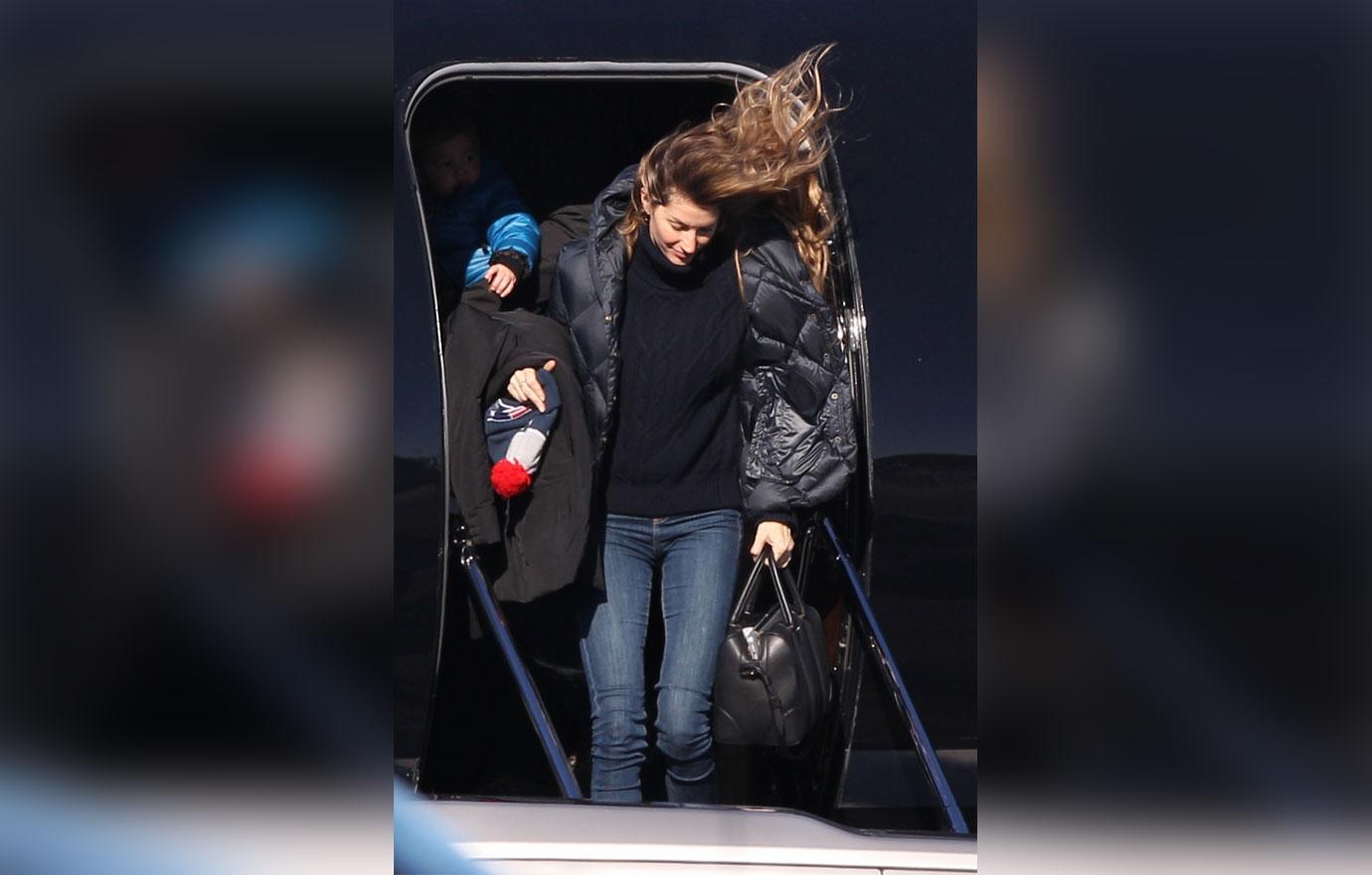 *EXCLUSIVE* Tom Brady and Gisele Bundchen land back in Boston with family after losing Super Bowl LII **WEB EMBARGO UNTIL 4AM PST ON 02/06/18**