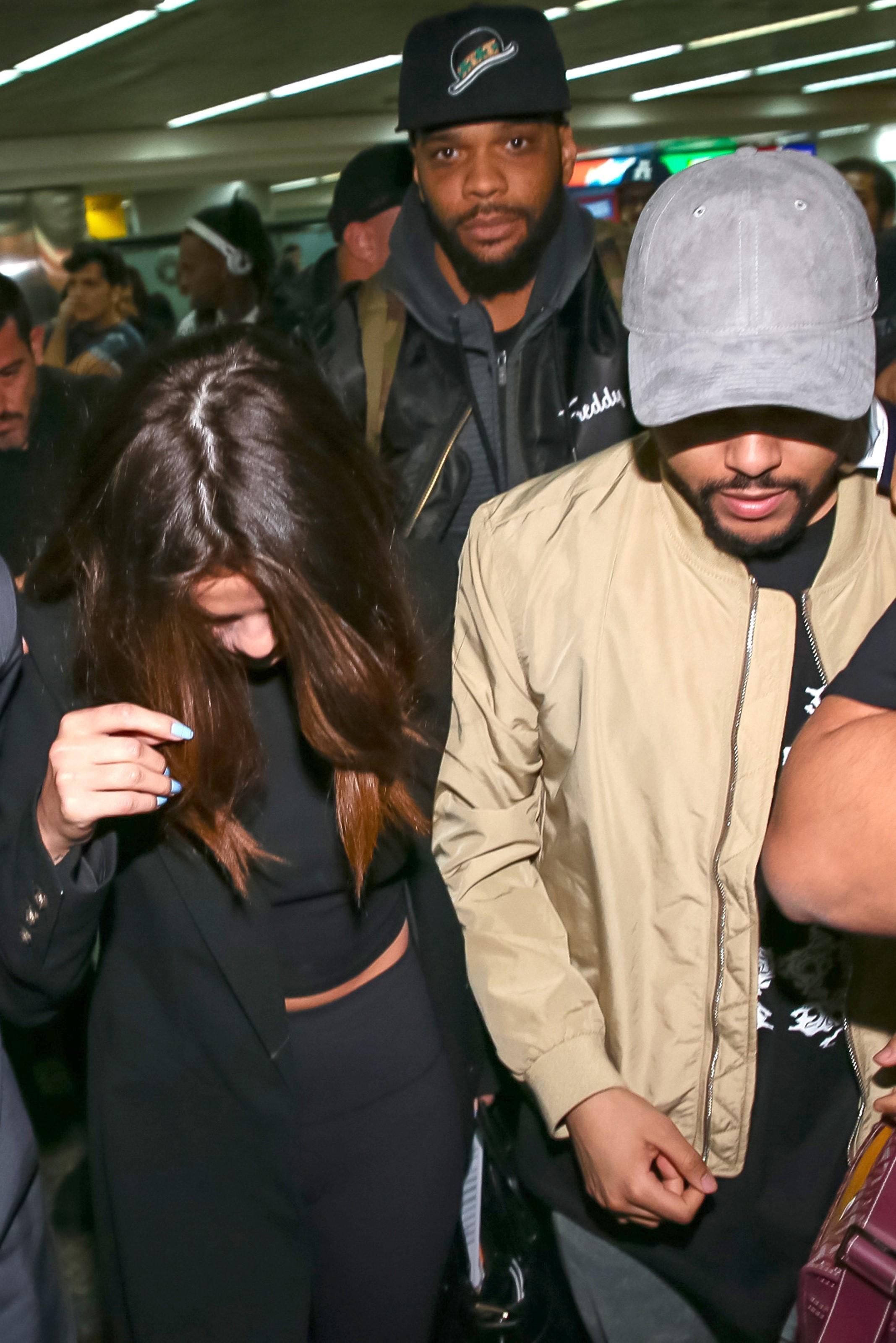 *EXCLUSIVE* Selena Gomez and The Weeknd struggle to make their way through crowds at Guarulhos airport