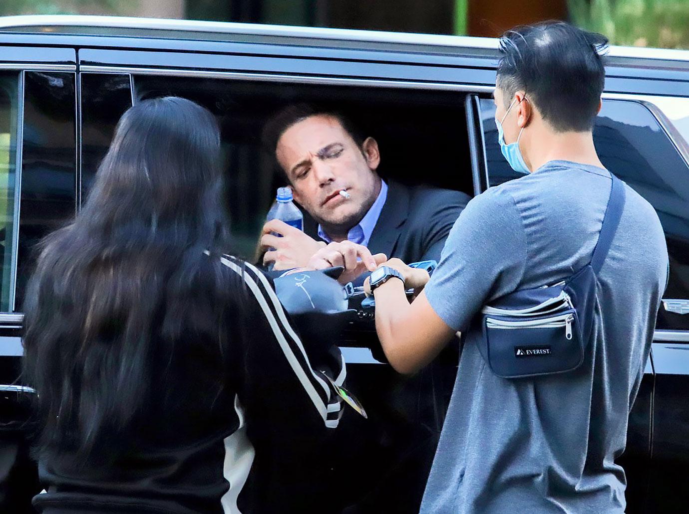 ben affleck smokes cigarette signs autographs at a red light while leaving the tender bar premiere jennifer lopez