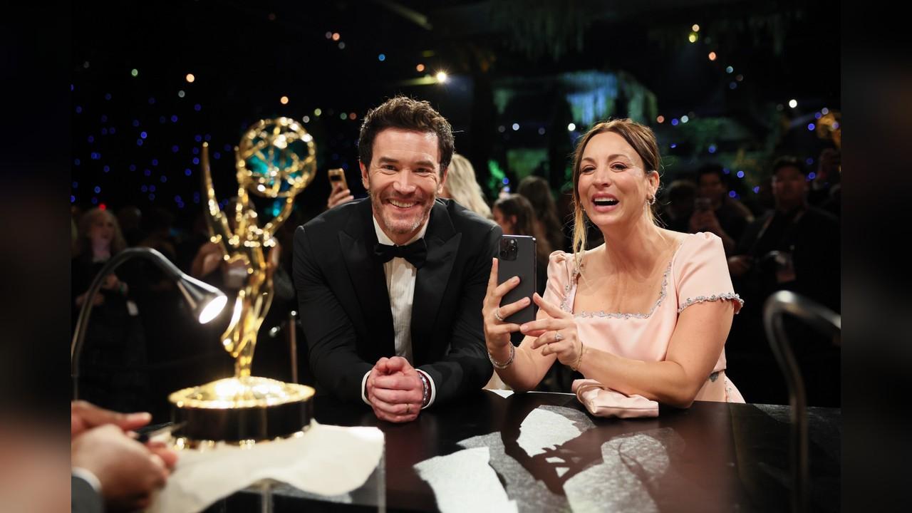 Image ofTom Pelphrey and Kaley Cuoco were all smiles as they celebrated his Emmy win together at the Disney bash.
