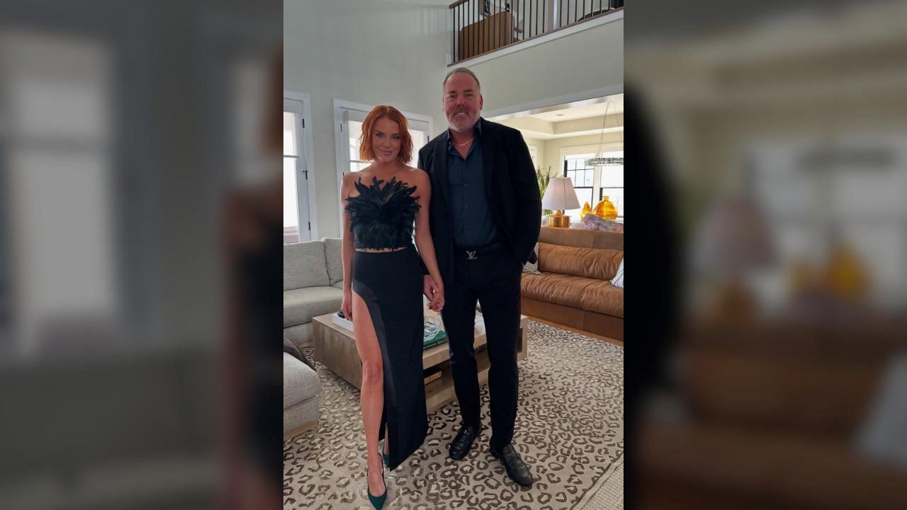 image of Whitney and Justin Rose in complementing outfits