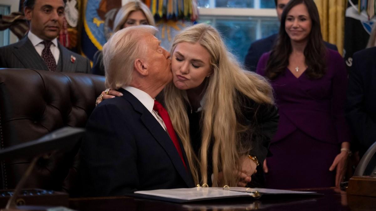 image of Donald Trump is close with Erika Kirk. 