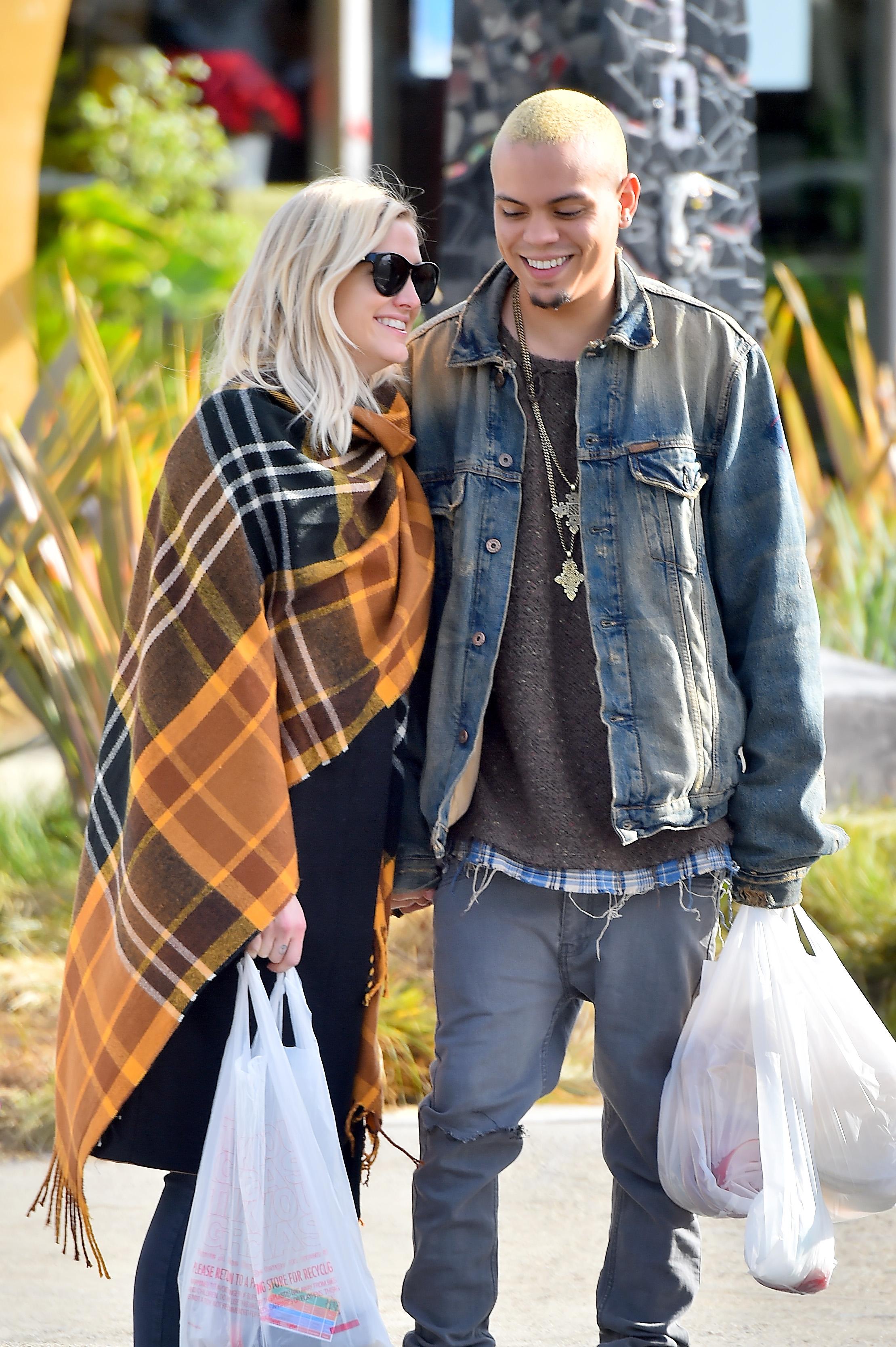 Ashlee Simpson and her husband Evan Ross enjoy sampling fruits and vegetables at a farmers market in Studio City