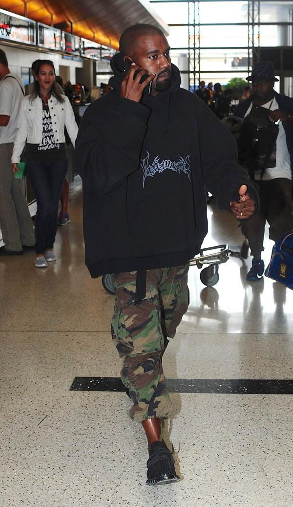 Kanye West arrives for flight at LAX in Los Angeles, CA