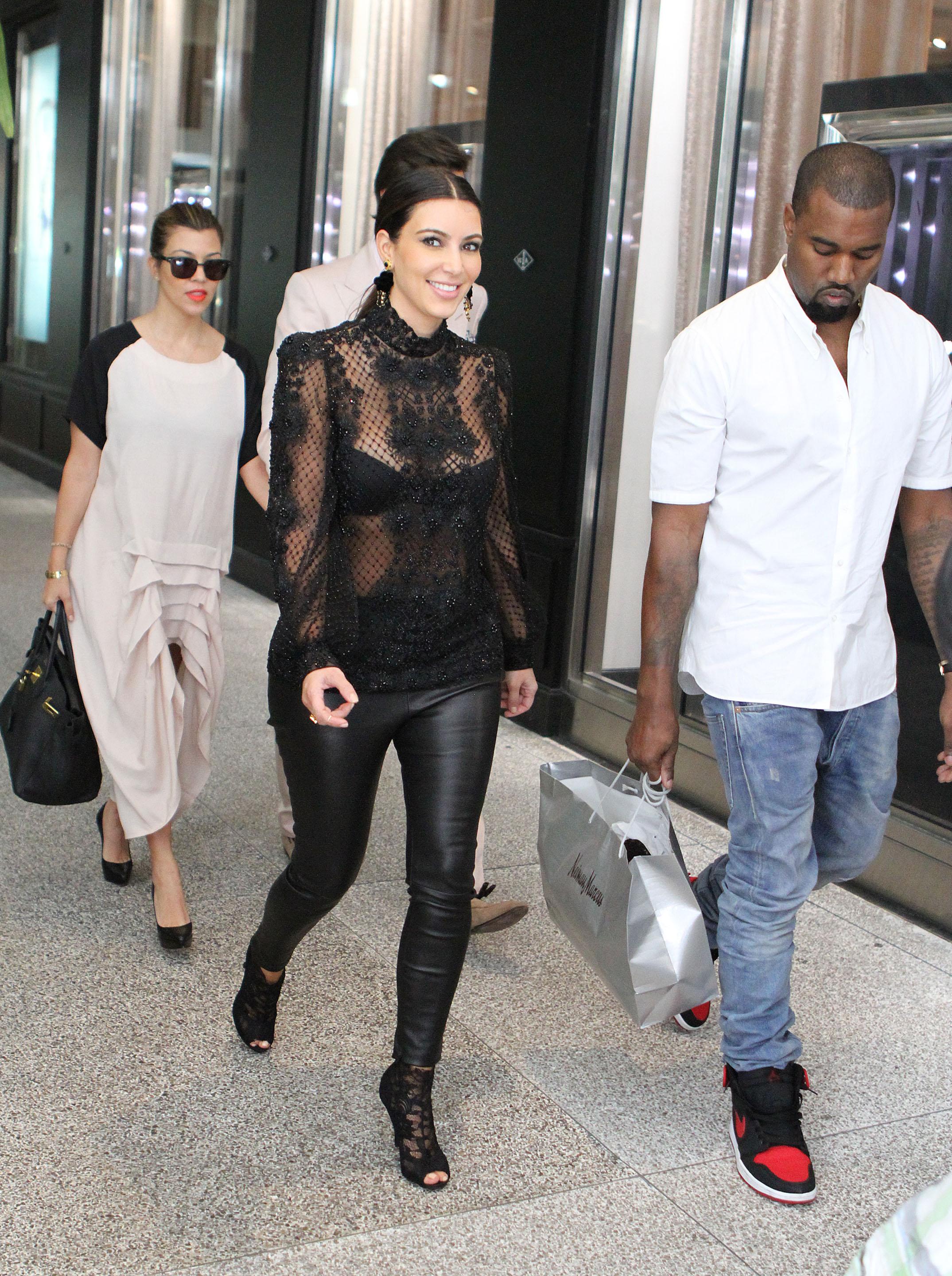 Kim Kardashian, Kayne West, Kourtney Kardashian and Scott Disick spotted going to lunch and shopping at Bal Harbour Shops in Miami