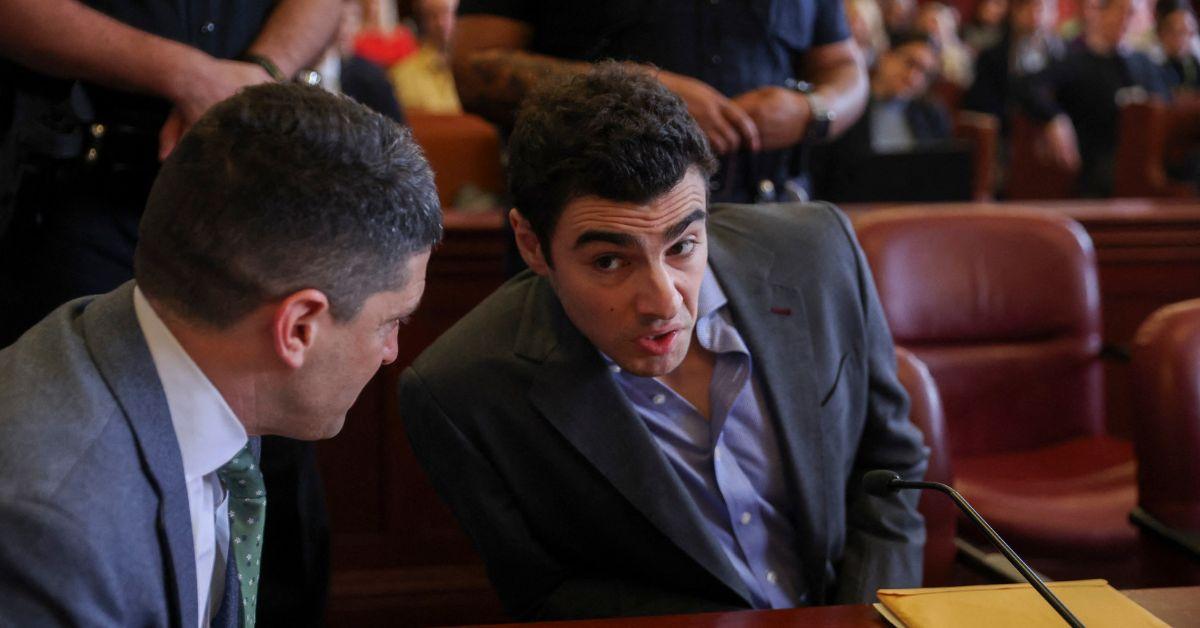 image of A red notebook containing his 'manifesto' was also found in his backpack.