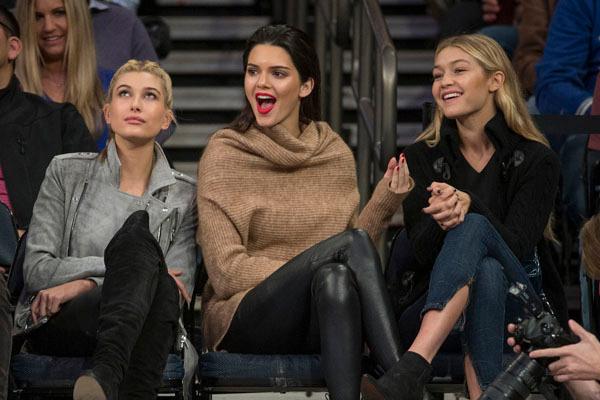 Kendall Jenner sits court side during NY Knicks game at Madison Square Garden with with Hailey Baldwin and Gigi Hadid