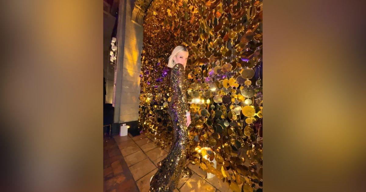 image of Tori Spelling made a striking red carpet return at the 'Michael' premiere in a shimmering gold gown.