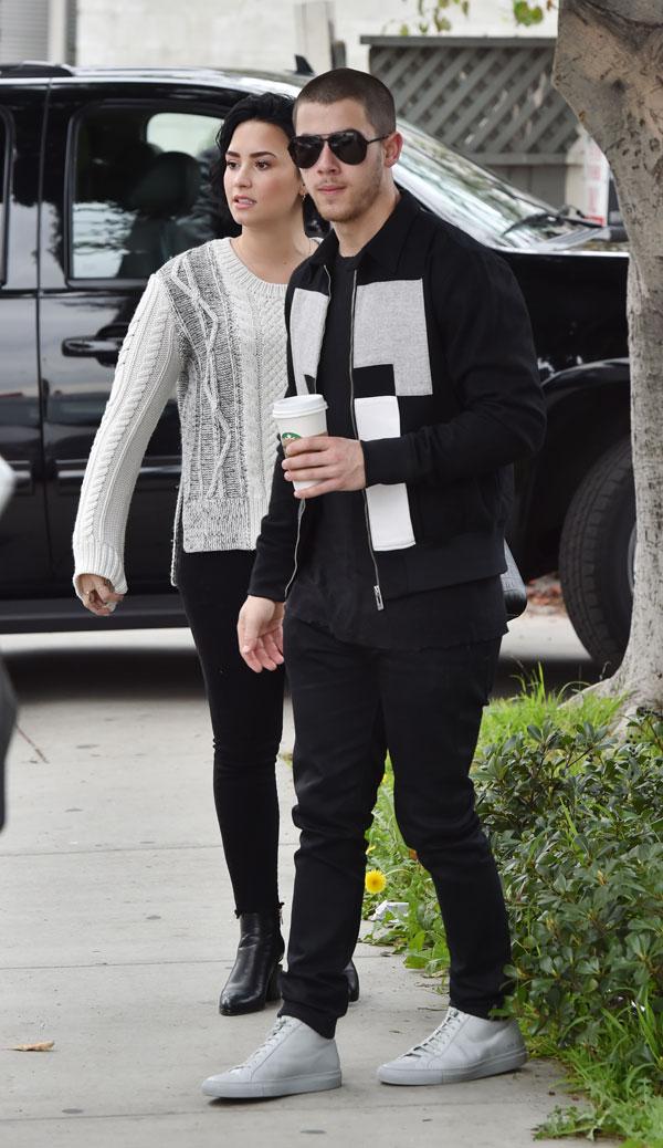 demi lovato nick jonas hugging while getting coffee