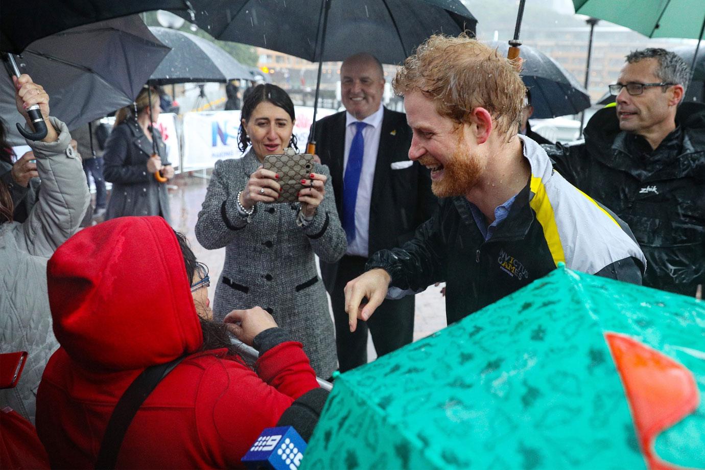 Prince Harry Australia Visit Rain Photos 02