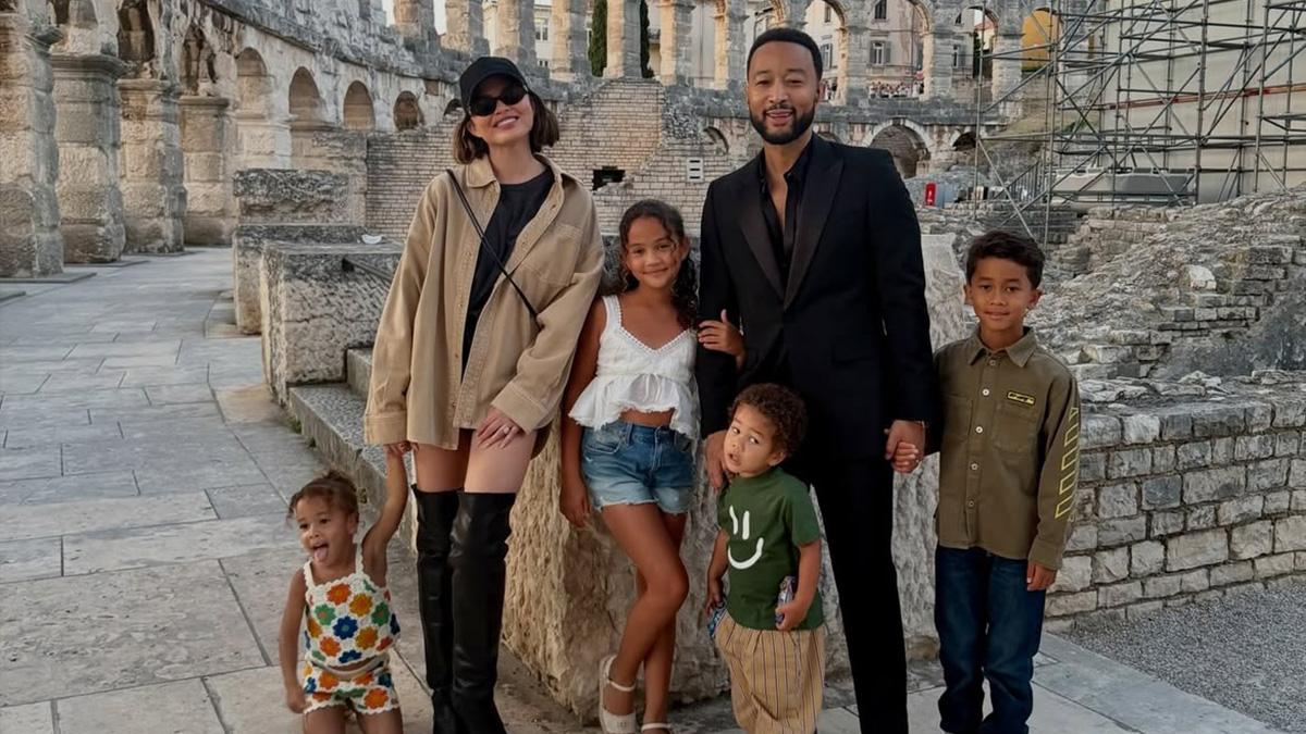 Image of Chrissy Teigen and her family posed for a photo.