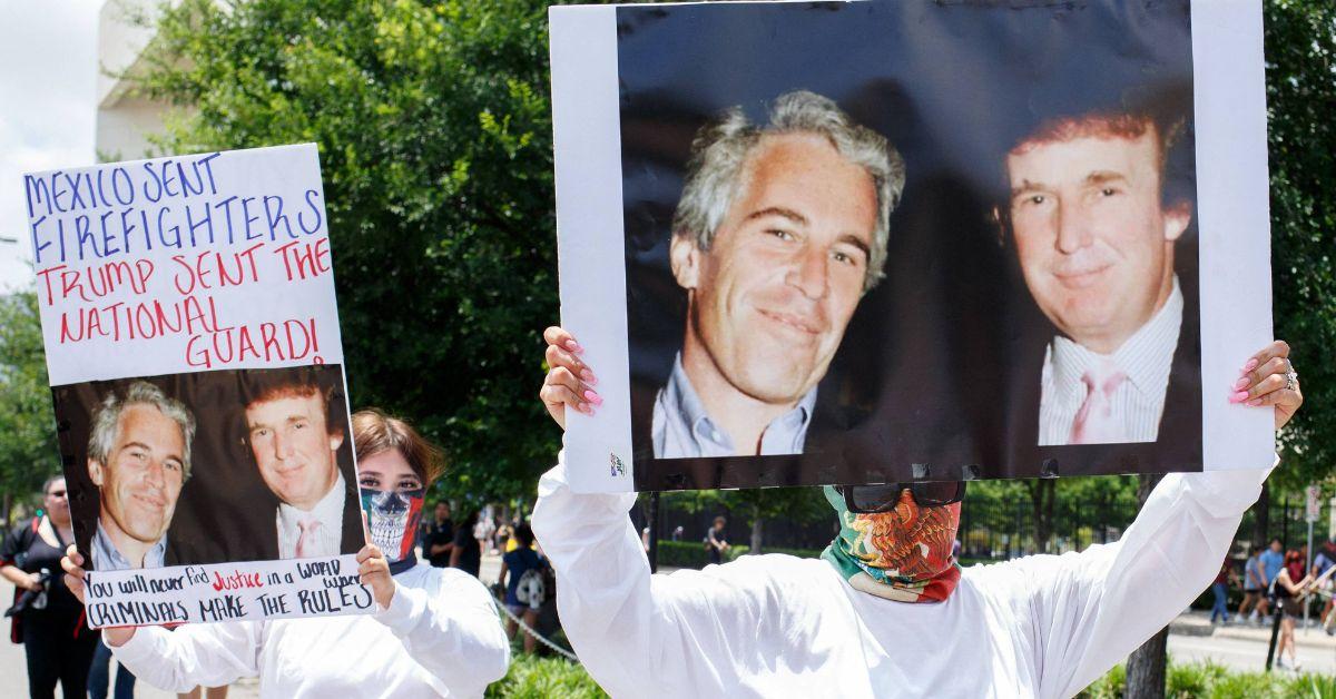 Photo of two women holding images of Donald Trump and Jeffrey Epstein