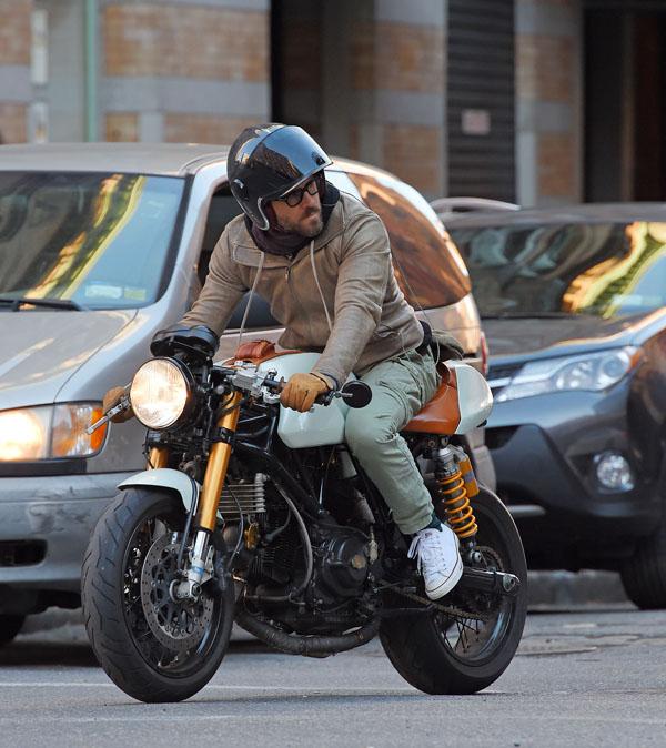 Ryan Reynolds looks cool in a leather jacket as he rides motorcycle in Tribeca, NYC