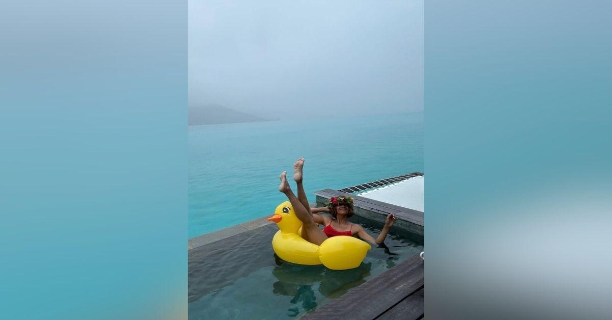 image of Halle Berry shared poolside pics in a red one-piece.