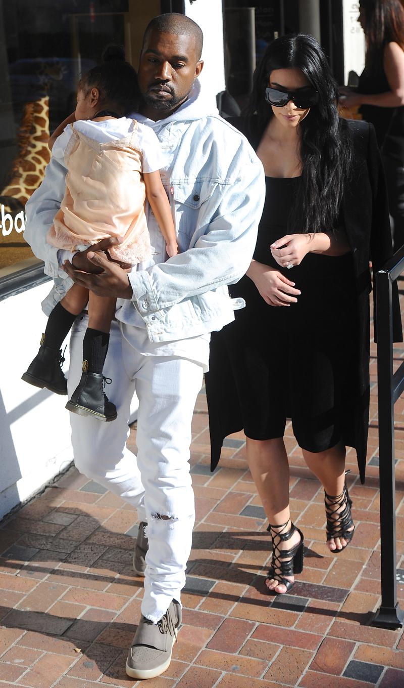 Kim Kardashian, Kanye West and North West are seen leaving Bel Bambini in Beverly Hills, CA