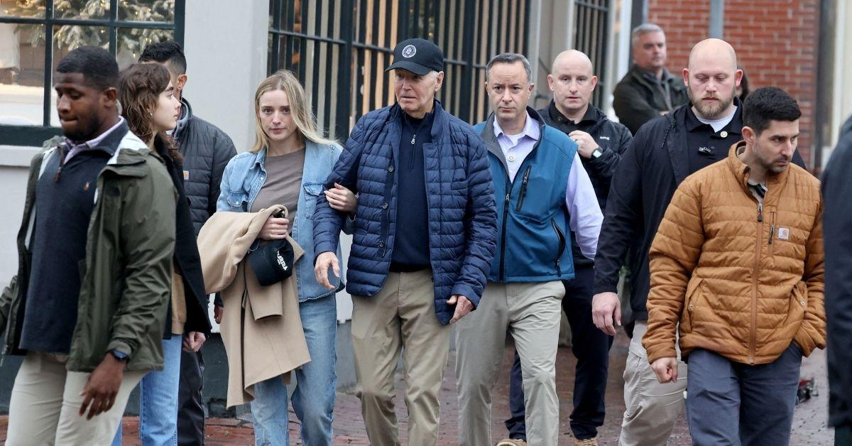 image of Fans noticed the former president was barely visible in the background of the Christmas photo. 