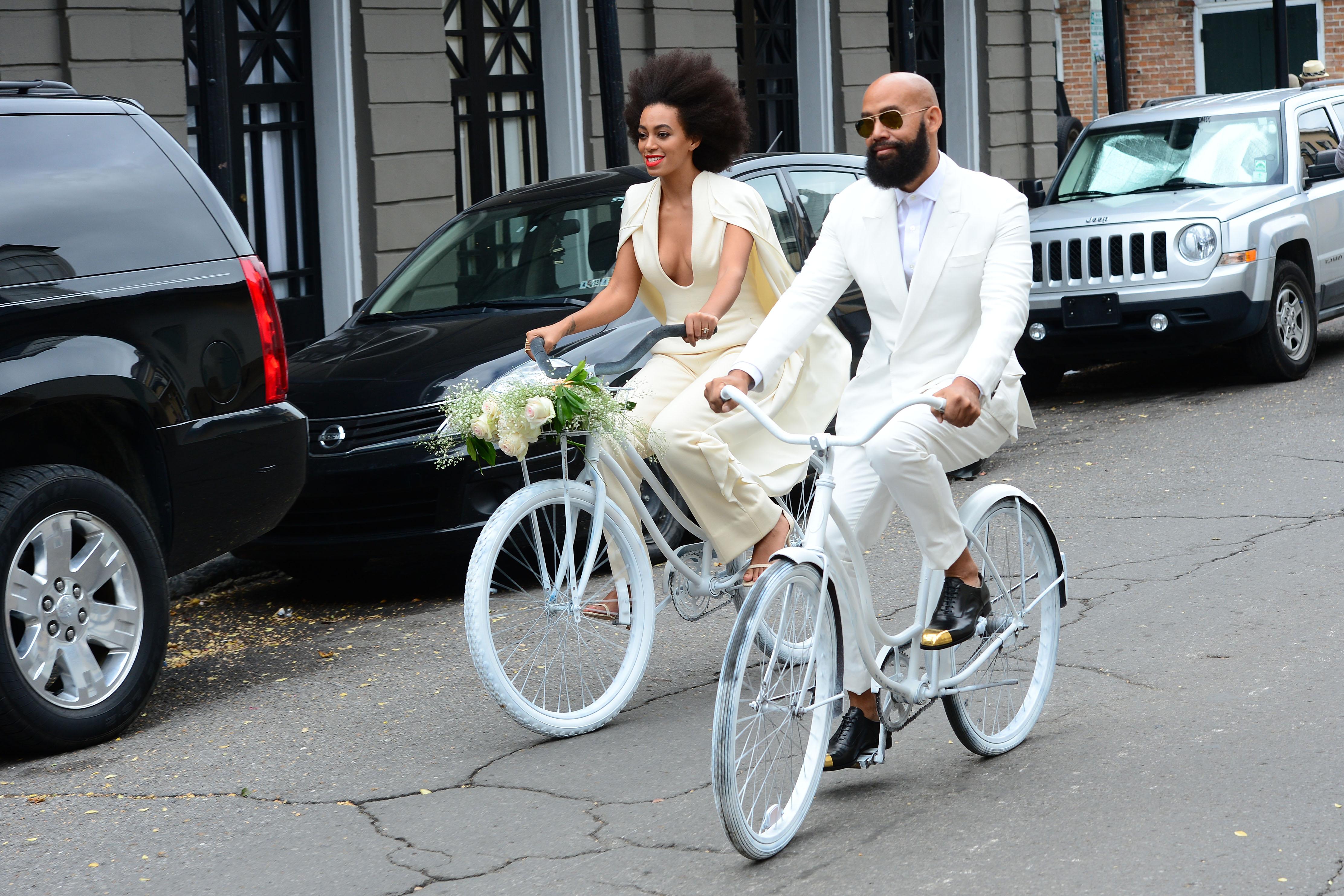 Solange Knowles and Alan Ferguson ride bikes wearing white on their wedding day