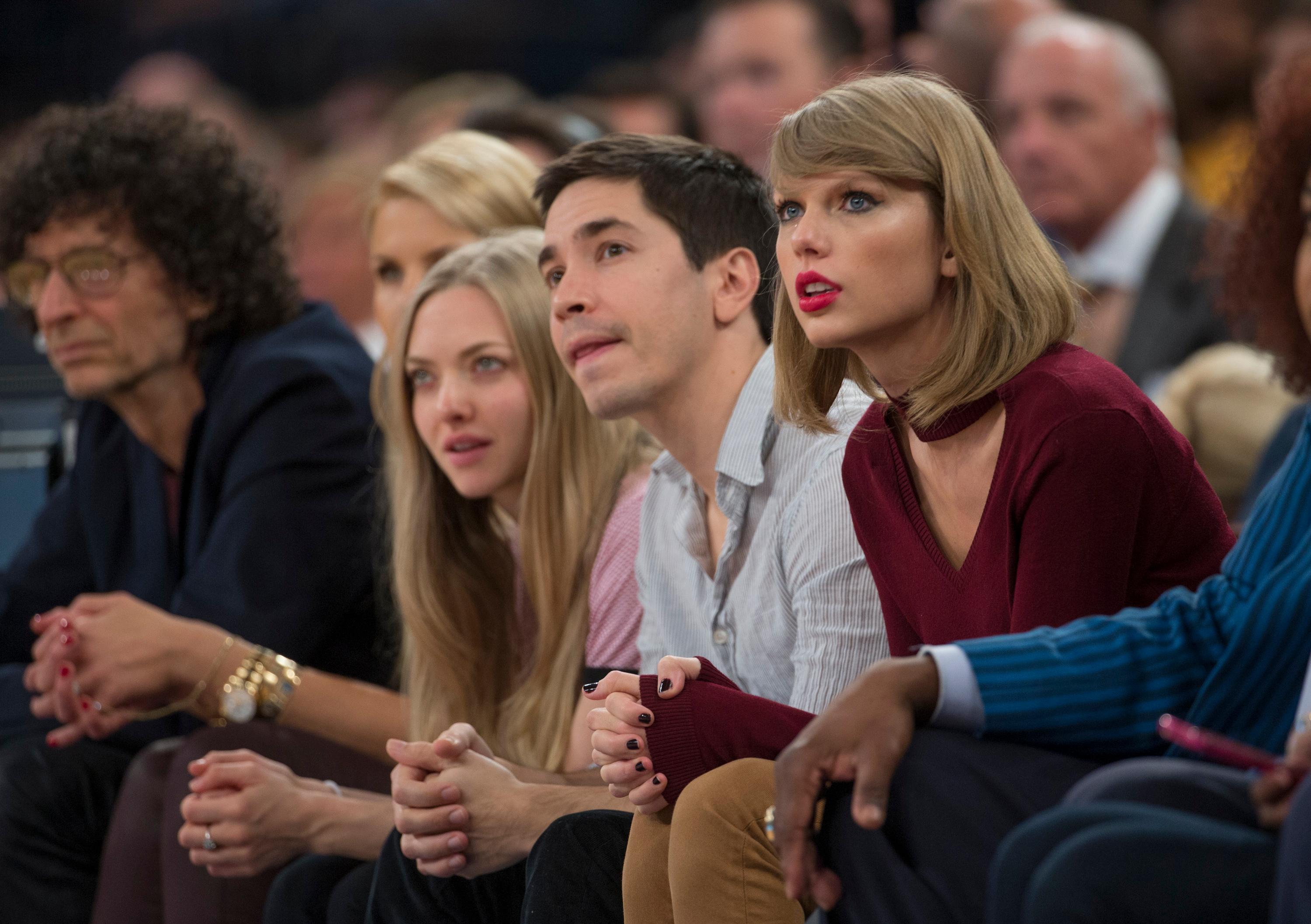 Justin Long and girlfriend Amanda Seyfried sit court side with Taylor Swift and Kate Upton at tonights New York Knicks game