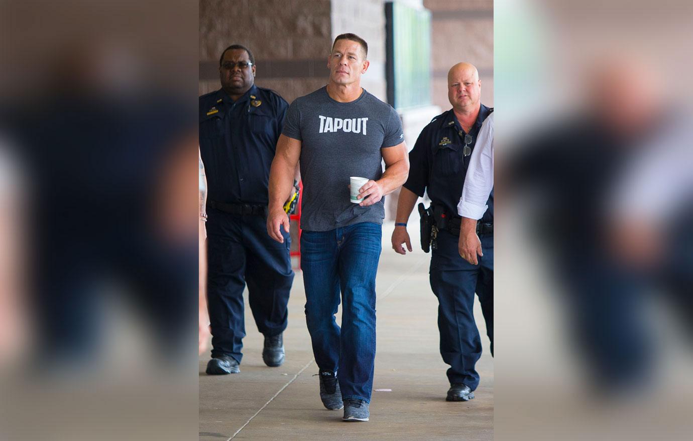 EXCLUSIVE: John Cena arrives at a movie theatre in New Orleans with police and an entourage.