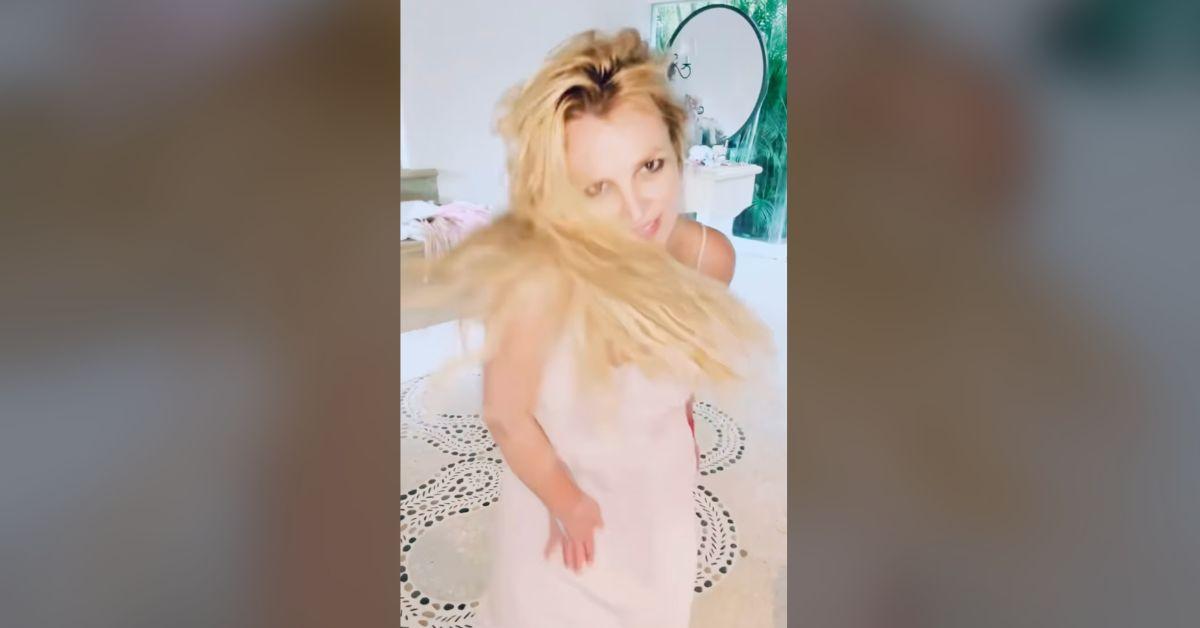 Image of Britney Spears whipped her hair wildly in an erratic dance video.