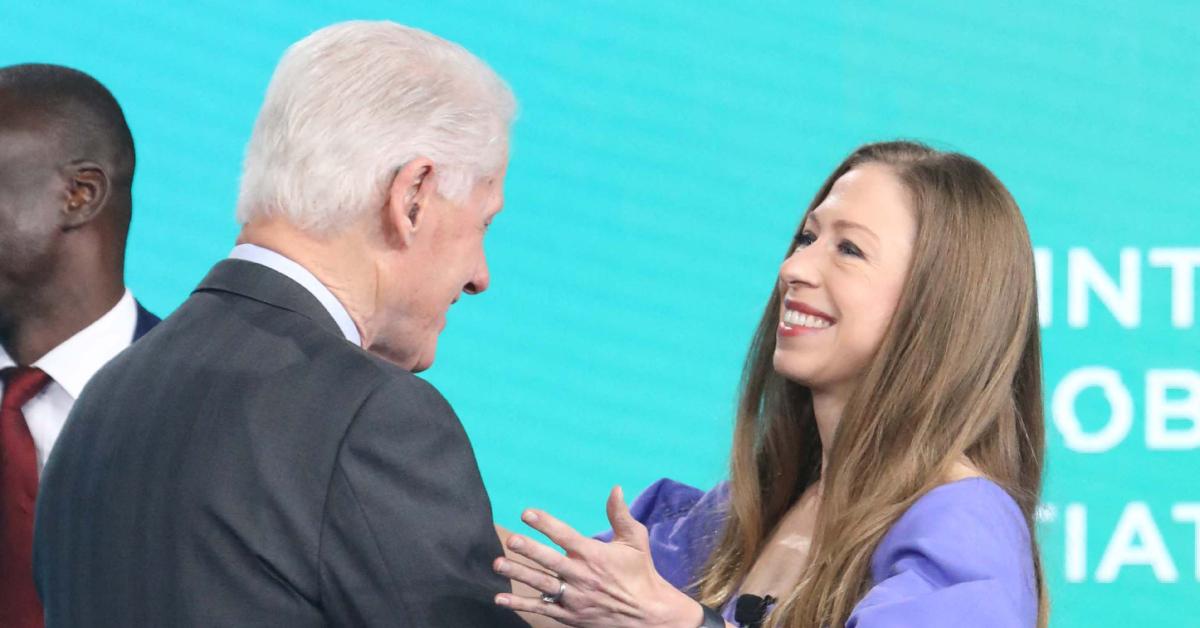 Image of Bill Clinton cheered on his daughter, Chelsea, at the NYC Marathon.