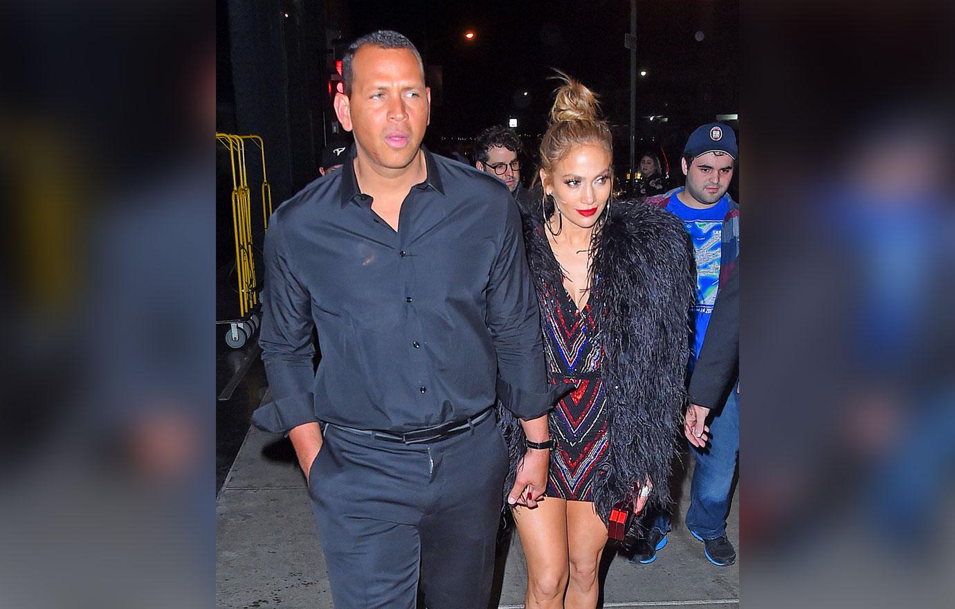 Jennifer Lopez and Alex Rodriguez hold close to each other as they leave Met Gala after party