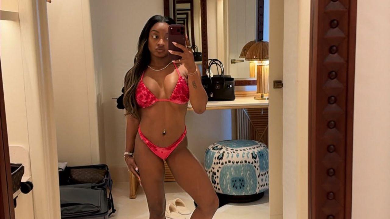 Image of Simone Biles wore a flattering string bikini for the photo. 