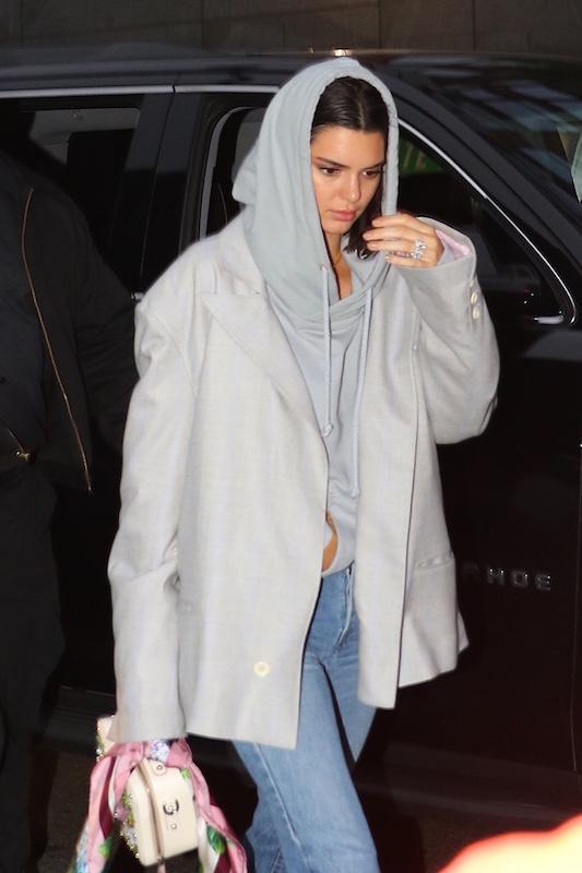 Kendall Jenner shows off a diamond ring on her engagement finger while out with ASAP Rocky