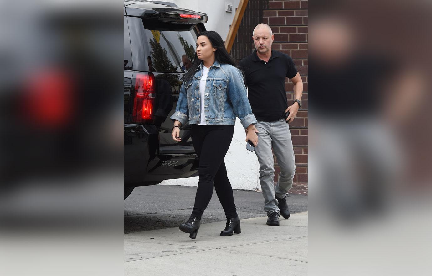 Demi Lovato is spotted heading to a office building after working out at the gym