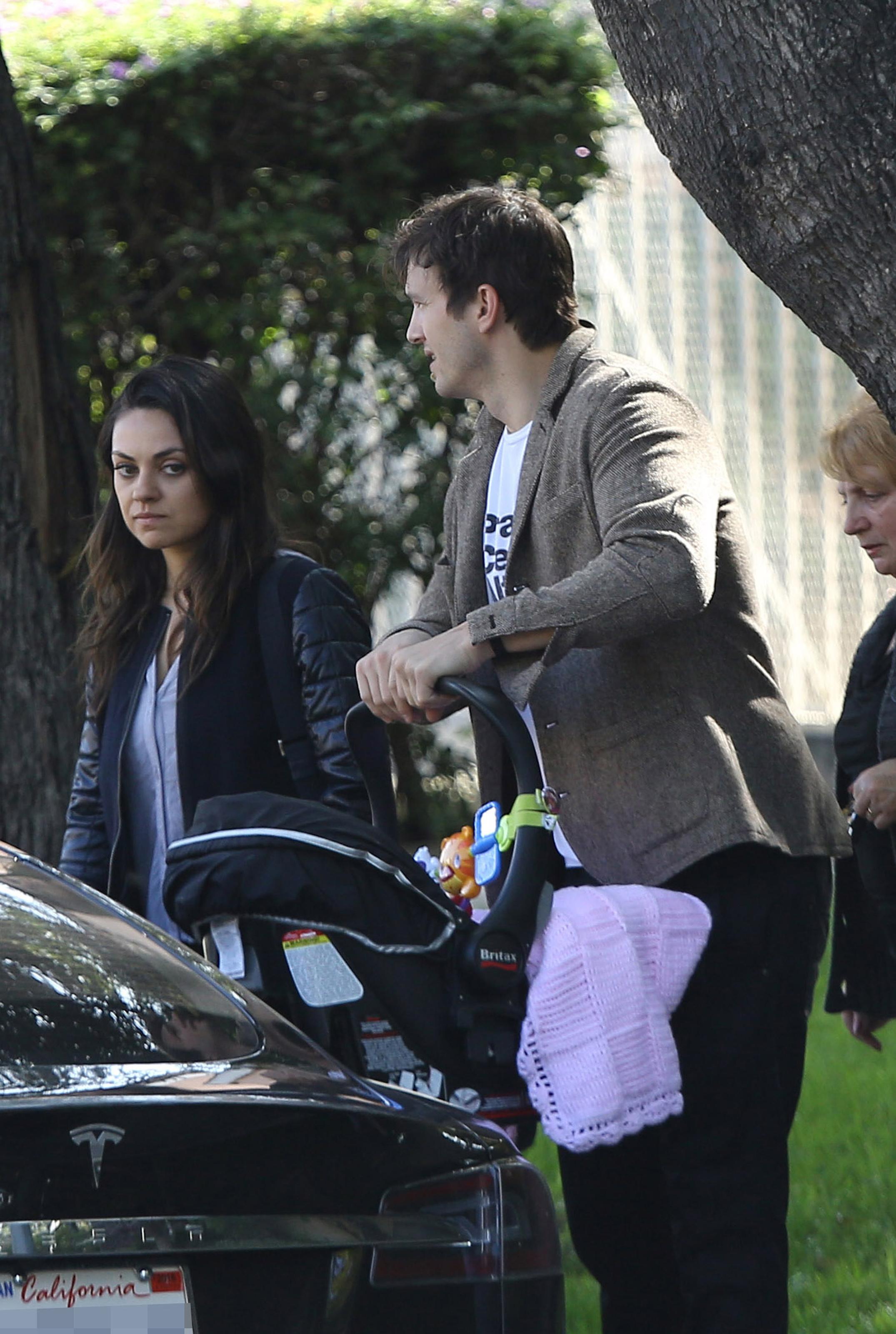 Ashton Kutcher and Mila Kunis enjoy a day out with baby girl Wyatt and parents