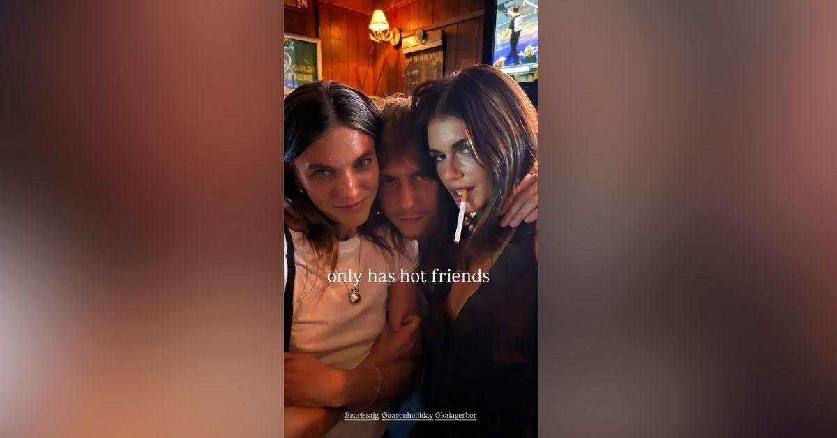 image of The model posed with friends while giving a playful glance over her shoulder.