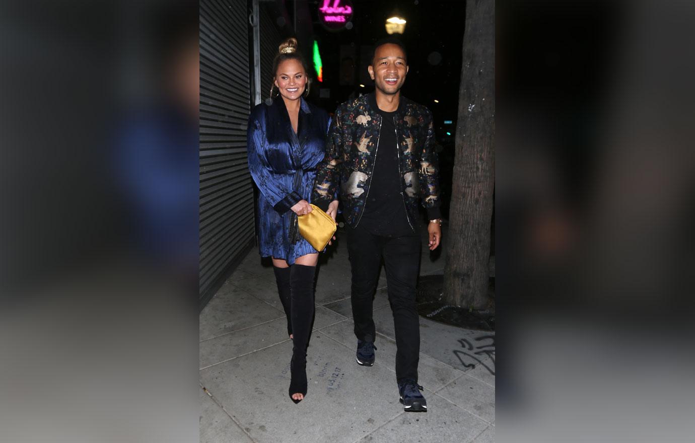 Chrissy Teigen and John Legend walk hand in hand as they exit Jon &amp; Vinny&#8217;s restaurant after dining with friends