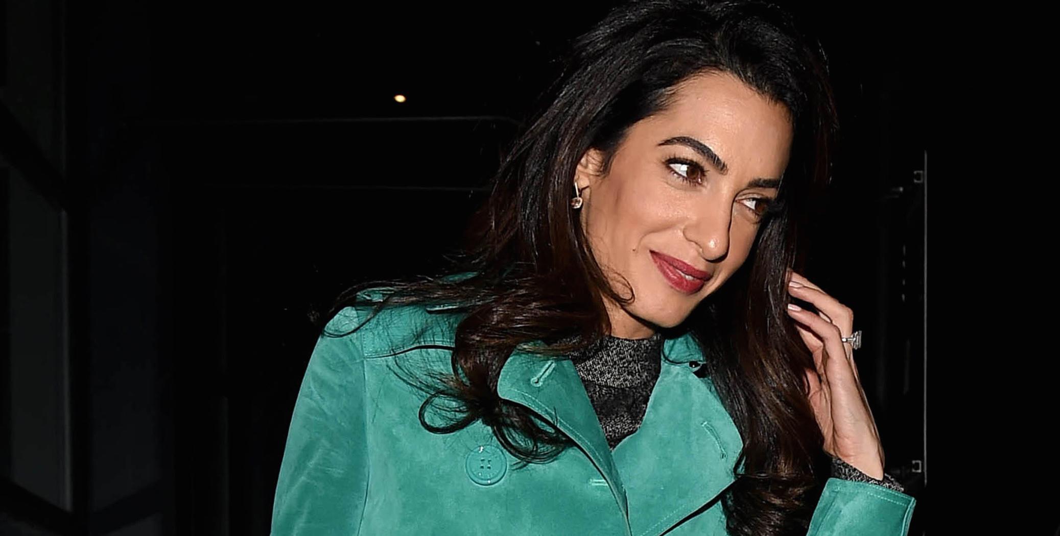 Amal Clooney looks great in a Burberry trench coat out in London**USA ONLY**