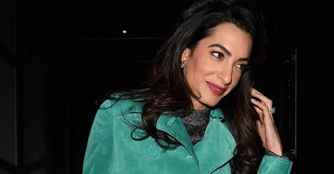 Amal Clooney looks great in a Burberry trench coat out in London**USA ONLY**