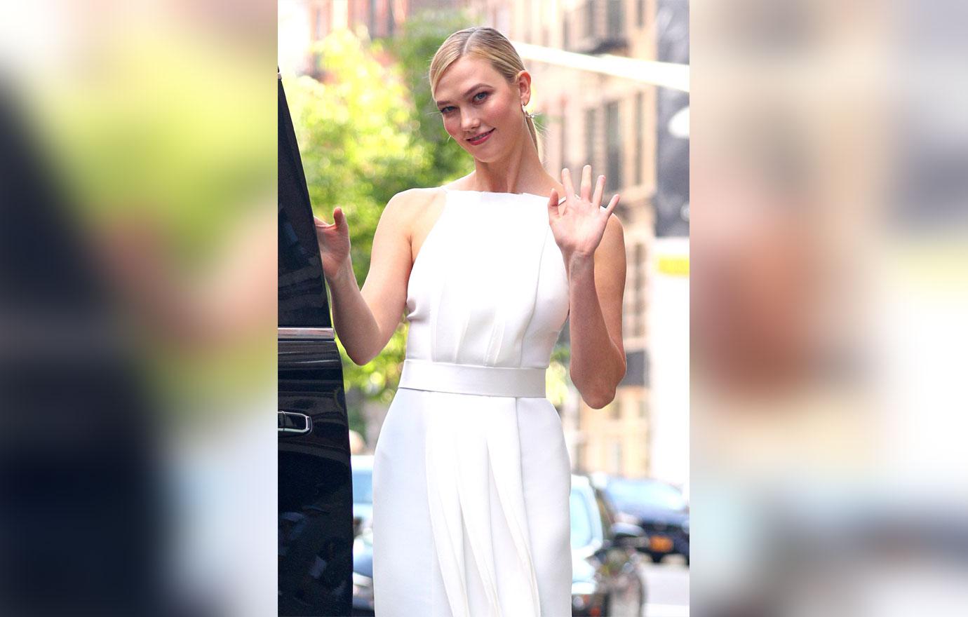 karlie kloss in white dress and waving