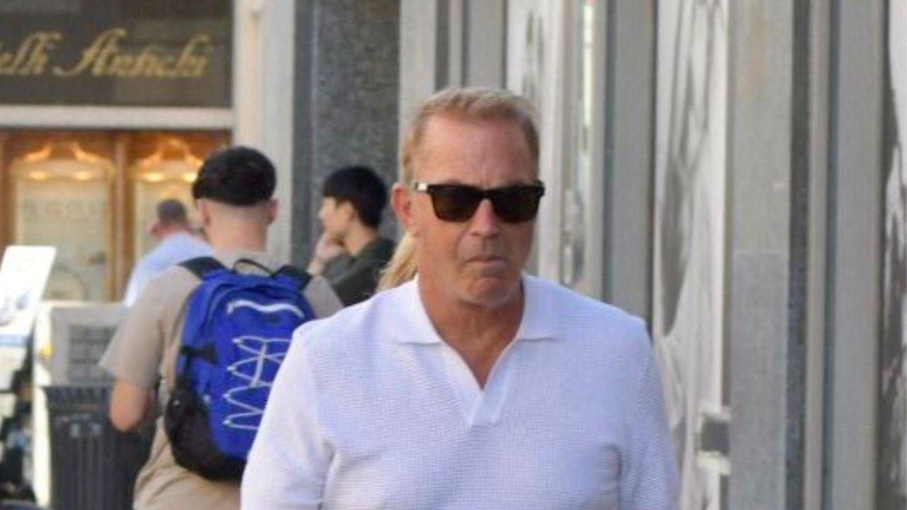image of Kevin Costner was photographed with Jennifer Milburn during a grocery run.
