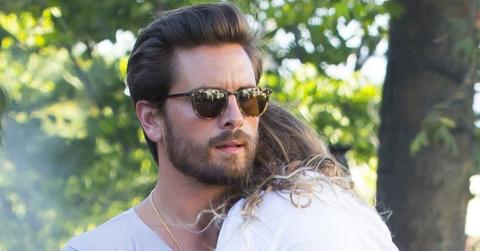 Scott Disick carries a sleepy Penelope after dinner