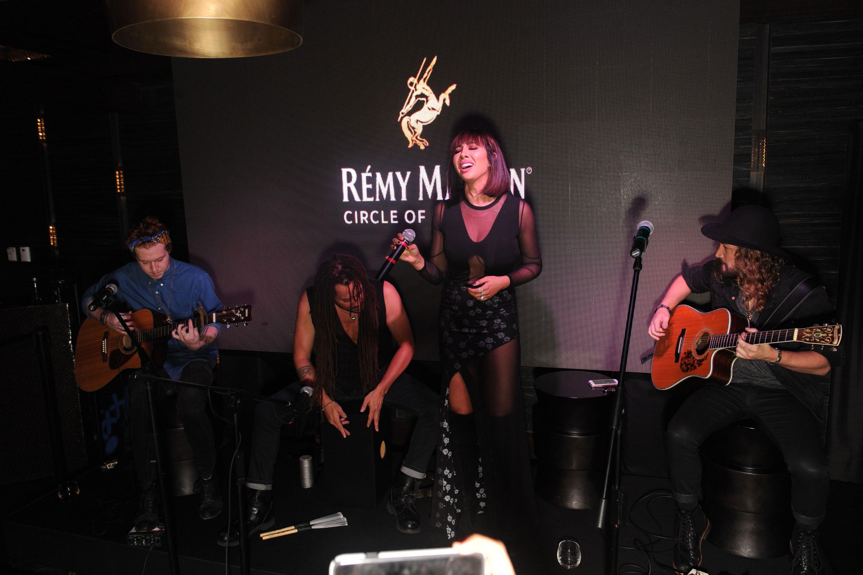 Jackie cruz peforming with her band the family portrait