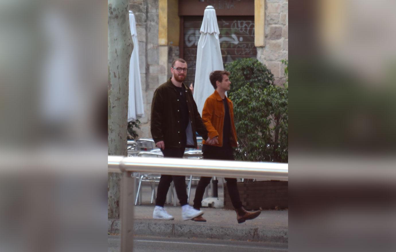 EXCLUSIVE: Sam Smith and boyfriend Brandon Flynn head out to dinner in Barcelona