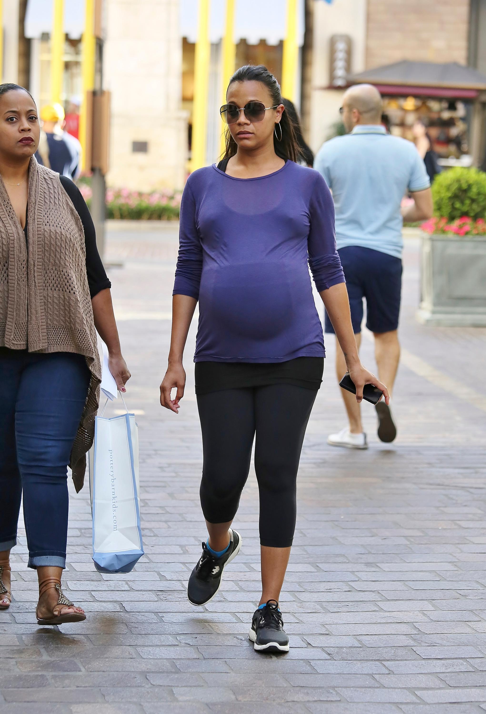 Pregnant Zoe Saldana shops at The Grove in West Hollywood, California