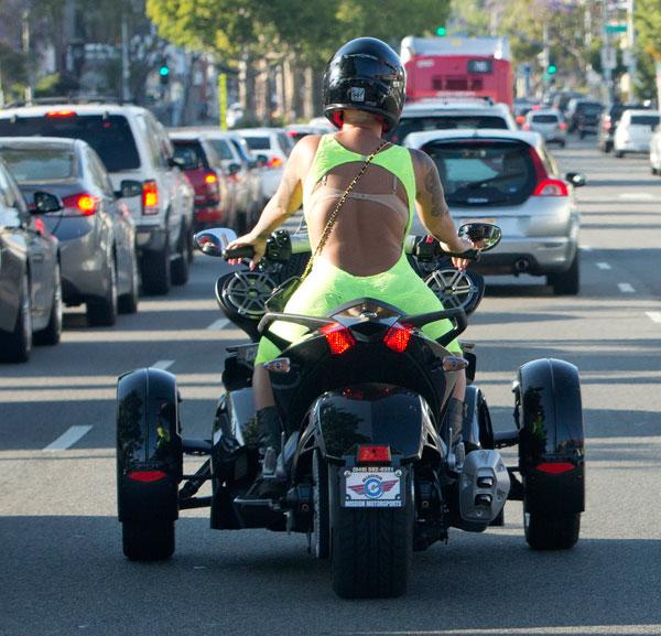 Amber rose blac chyna wearing body suits riding motorcycles