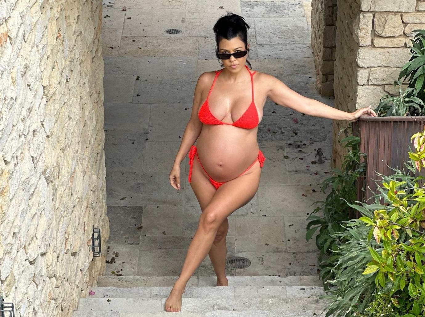 Kourtney Kardashian shows off her stomach in SKIMS bra as fans convinced  she's pregnant with Travis Barker's baby