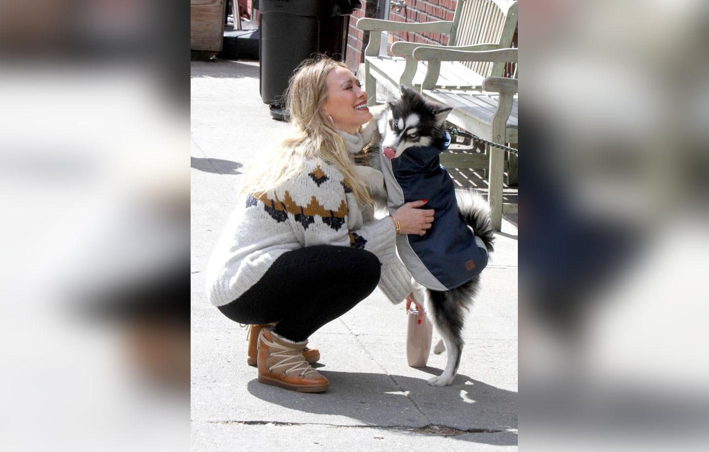 Hilary Duff Plays With a Husky Puppy on the set of Younger