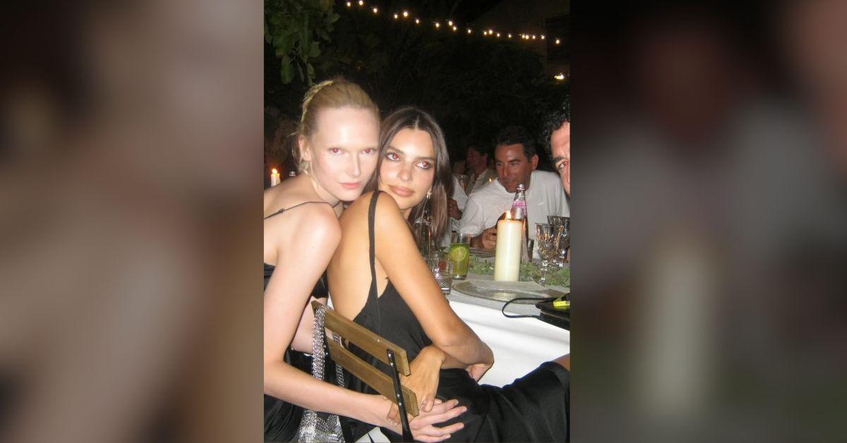 Image of Emily Ratajkowski posed with Alex Consani at dinner.