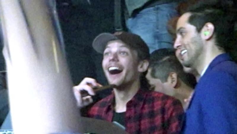 EXCLUSIVE: Louis Tomlinson parties in Vegas and puffs on lit object in his mouth and hand while dancing to the beats of Avicii inside the XS nightclub