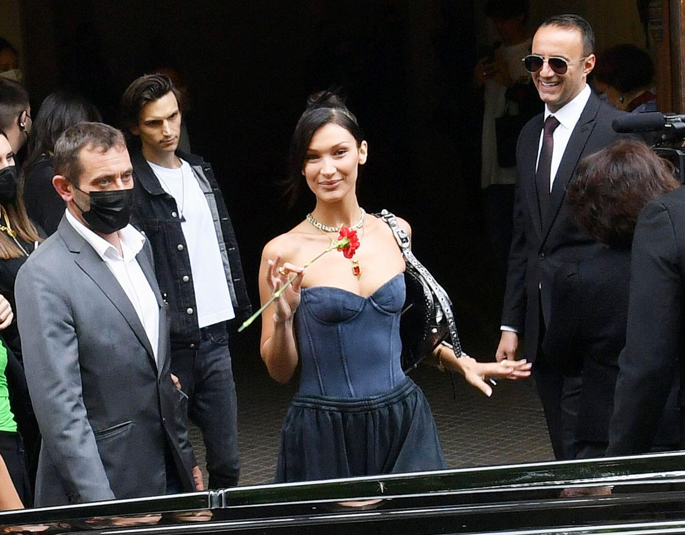 bella hadid holding flower paris fashion week