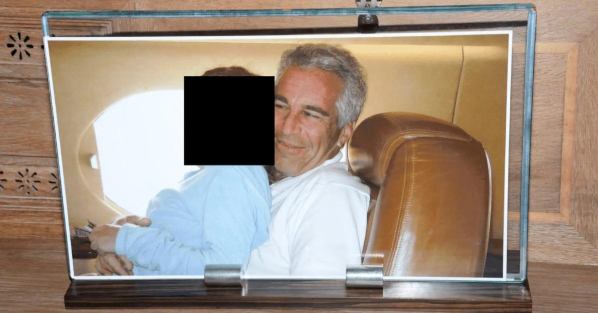 Image of Jeffrey Epstein smiled with a little girl on his lap aboard his private jet.