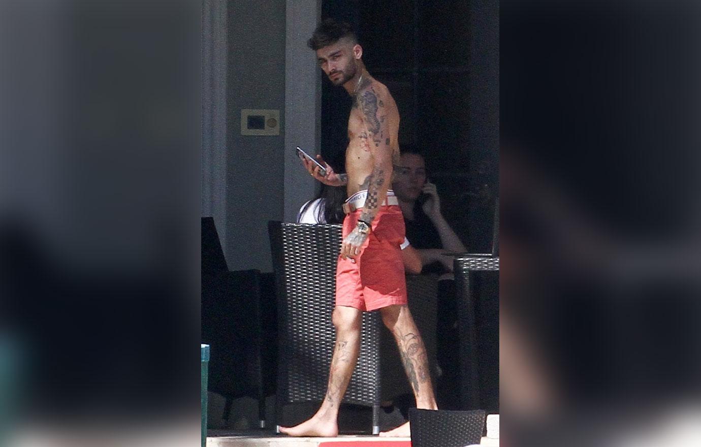 Zayn Malik looks extremely thin as he chain smokes by the pool after split from Gigi Hadid